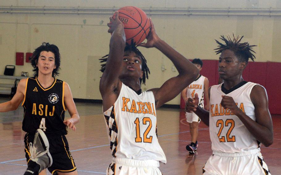 Kadena's DeShaun Nixon hit the last two baskets that helped give the Panthers their record sixth boys title in the 17th Okinawa-American Friendship Basketball Tournament.