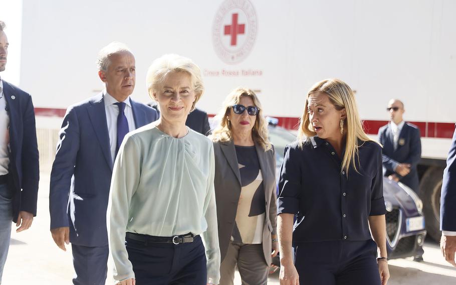 The President of the European Commission, Ursula von der Leyen, front left, and the Italy's Premier Giorgia Meloni, front right, visit the island of Lampedusa, in Italy, Sunday, Sept. 17, 2023. 