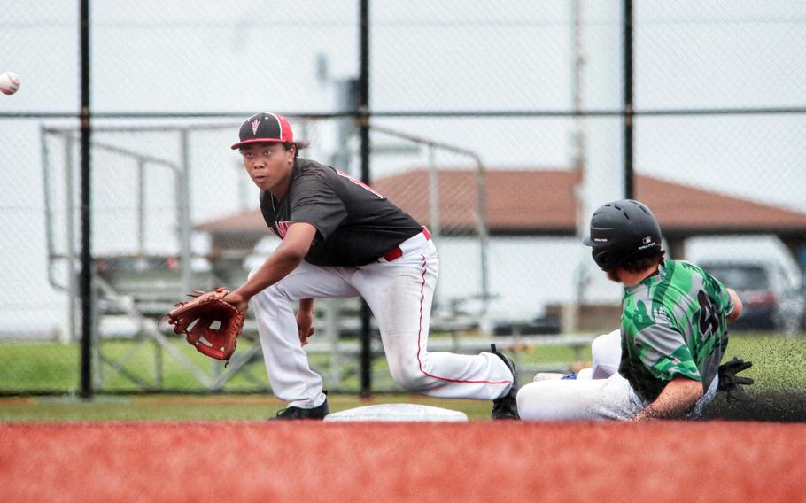 Kubasaki's Lukas Gaines slides into second base ahead of the throw to Kinnick's Arashi Blocton.