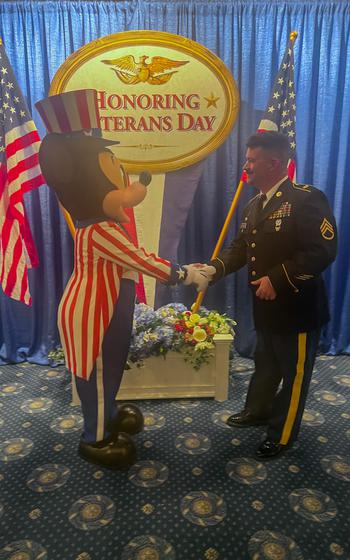 Sgt. 1st Class Nick Nofziger participates in the Veterans Day Flag Retreat Ceremony in November 2023 at Disneyland. 