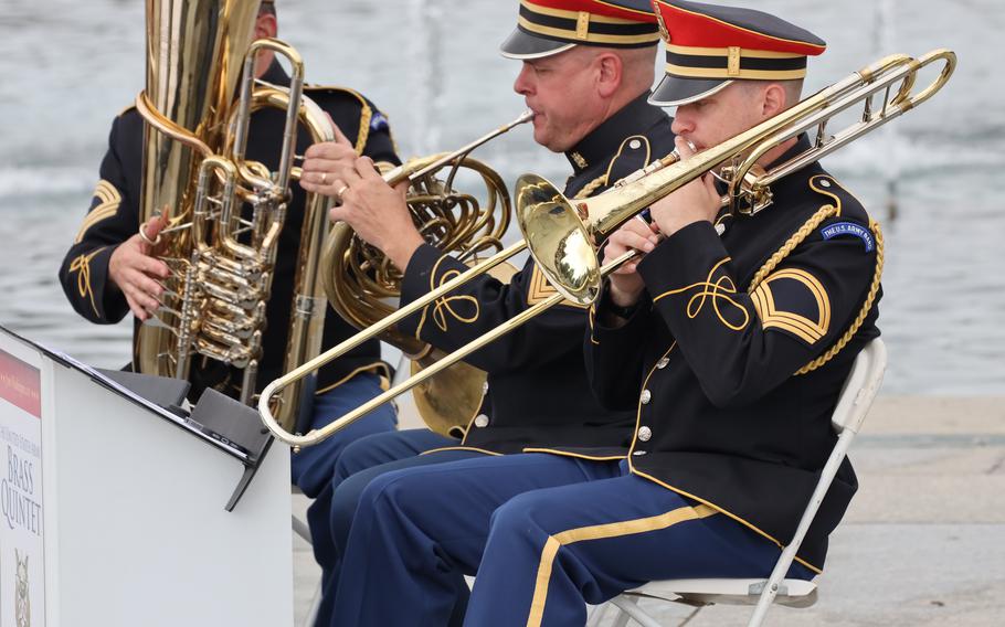 The U.S. Army Brass Quintet plays at the World War II Memorial on the National Mall in Washington, D.C., on Memorial Day, May 29, 2023.
