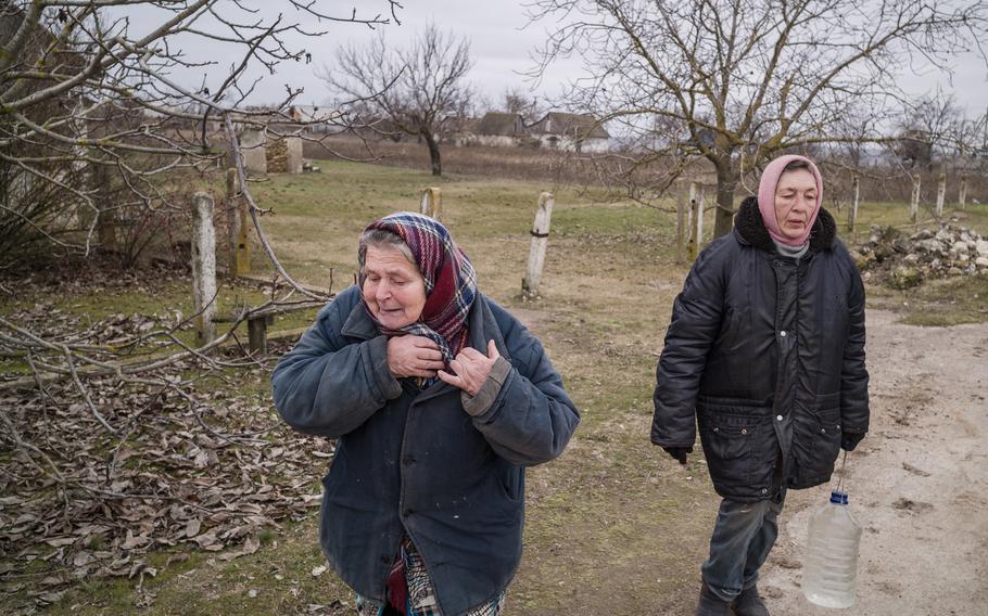 Lyuba Voznyak, 66, left, and Olha Perepada, 54, are among the few residents of Dudchany who decided to stay in the village.