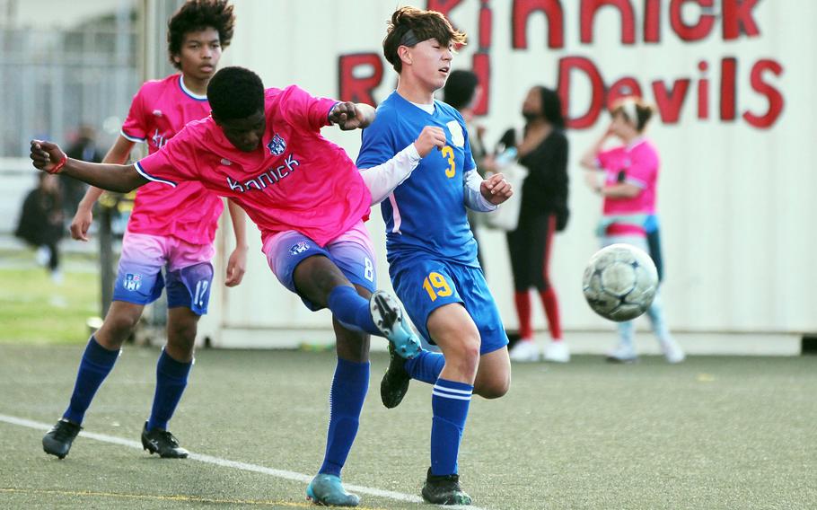 Nile C. Kinnick's Leon Awesso boots the ball past Yokota's Brandon Christenson during Thursday's DODEA-Japan/Kanto Plain boys soccer match. The Red Devils won 2-0.