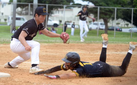 ASIJ third baseman Woochan Nam reaches down to tag Kadena baserunner Waioni Mandac. He was out on the play. The Panthers won 6-5.
