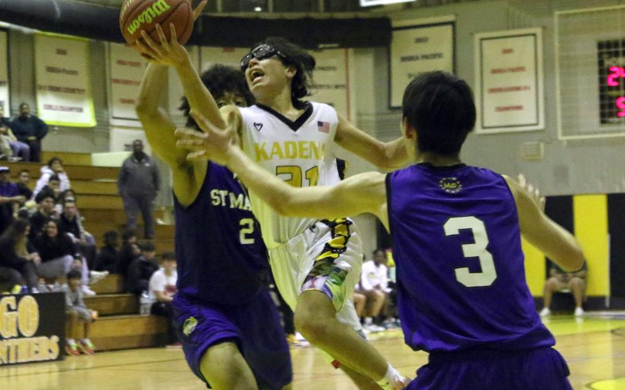 Kadena's Angel Torrado looks to shoot against St. Mary's Roy Igwe and Vincent Willis  in the boys D-I final.