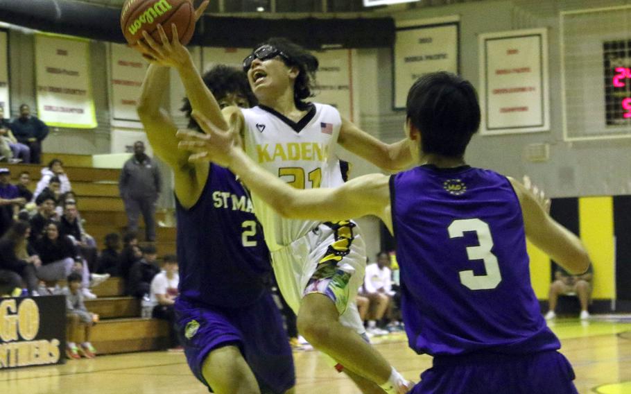 Kadena's Angel Torrado looks to shoot against St. Mary's Roy Igwe and Vincent Willis  in the boys D-I final.