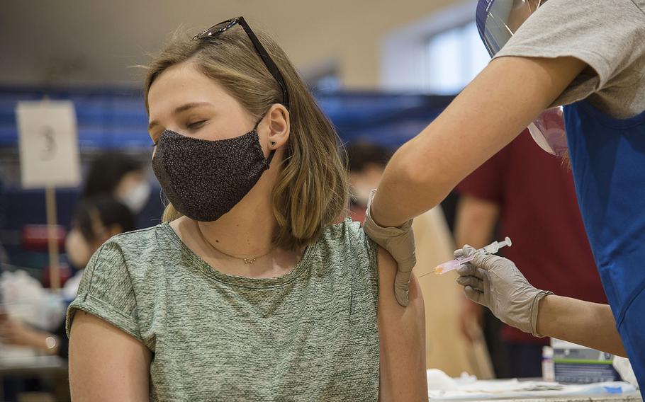 A woman receives a COVID-19 vaccine at Yokosuka Naval Base, Japan, April 21, 2021.