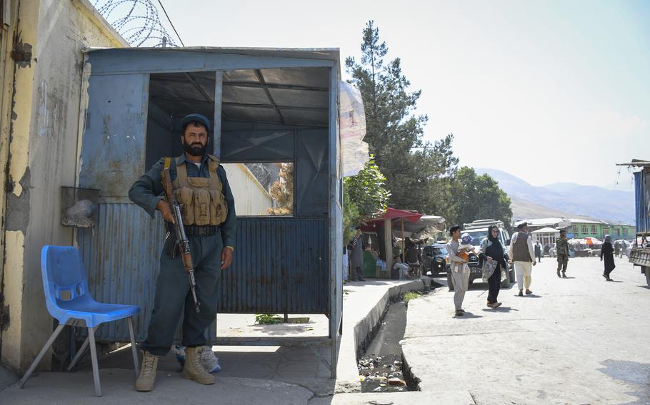 An Afghan policeman guards the entrance of a government building in Faizabad, the provincial capital of remote Badakhshan province, on July 15, 2019. The city was once a stronghold against the Taliban but has fallen to the militant group, local leaders said Aug. 11, 2021.