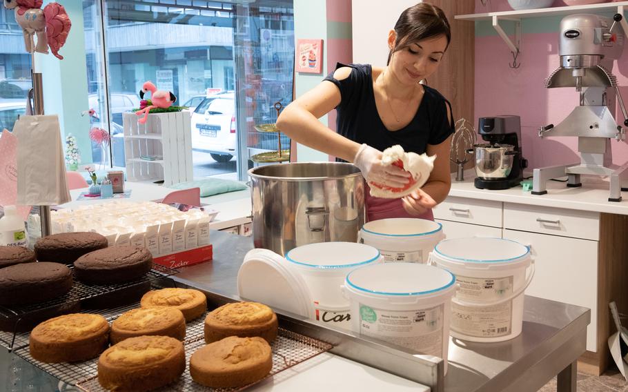 Ilona Riffel makes buttercream frosting at K-Town Cupcakes, in Kaiserslautern, Germany, Jan. 10, 2023. 