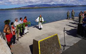 Kahu Kordell Kekoa performs a traditional Hawaiian blessing in August 2023 as the Navy begins construction on a new dry dock at Pearl Harbor Naval Shipyard and Intermediate Maintenance Facility.