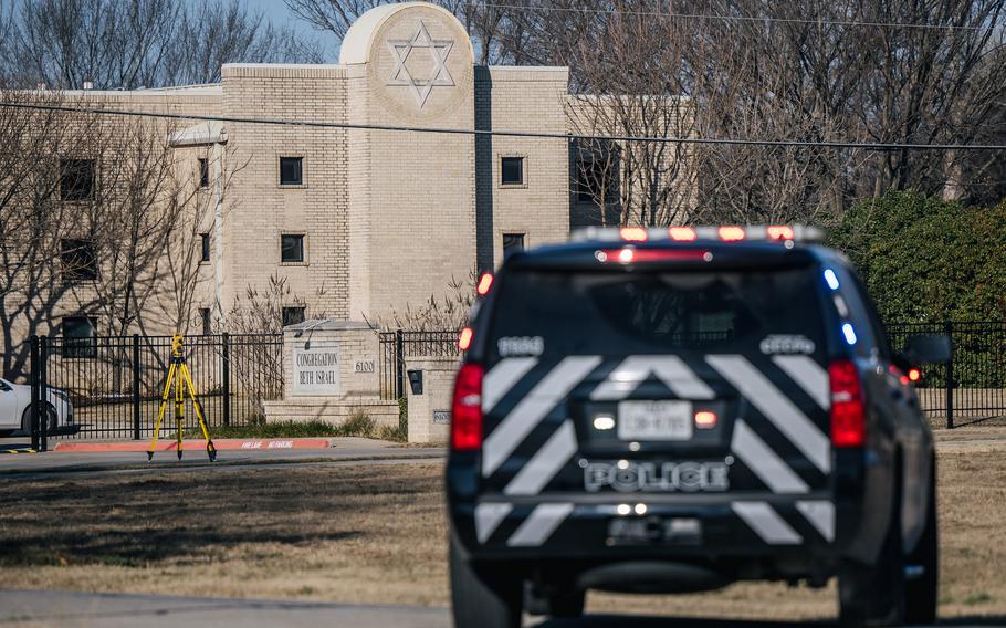 A law enforcement vehicle sits near the Congregation Beth Israel synagogue on January 16, 2022 in Colleyville, Texas. All four people who were held hostage at the Congregation Beth Israel synagogue were safely released after more than 10 hours of being held captive by a gunman. 