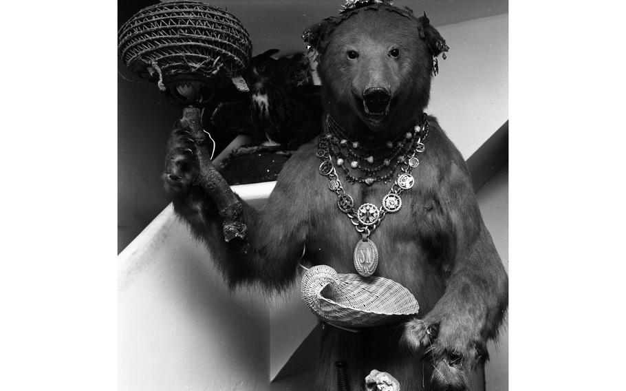 A huge bear wearing a necklace of emerald-cut jade and matching earrings greets visitors at the entrance of surrealist artist Salvador Dali’s home in Port Lligat on the Costa Brava, Spain.