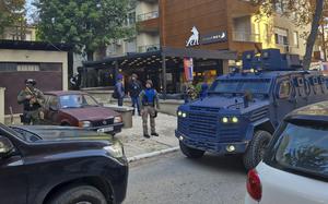 Kosovo police officers search restaurant and building in northern Serb-dominated part of ethnically divided town of Mitrovica, Kosovo, Friday, Sept. 29, 2023. In one of the worst confrontations since Kosovo declared independence from Serbia in 2008, about 30 masked men opened fire on a police patrol near the village of Banjska early Sunday. One Kosovo police officer and three gunmen were killed in Sunday's shootout between Serb insurgents and Kosovo police.