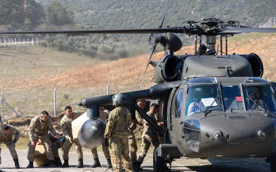 U.S. Army UH-60M Blackhawk assigned to 1st Armored Division, Combat Aviation Brigade (1AD CAB), delivers relief supplies to the Turkish relief authorities in Hassa, Türkiye, Feb. 21, 2023. The 1AD CAB provides dynamic lift capability in direct support of USAID and Turkish relief efforts, to those affected by the earthquakes in Türkiye. 1AD CAB is one of several U.S. military units supporting Task Force 61/2 (TF 61/2), operating under U.S. Sixth Fleet, U.S. Naval Forces Europe (NAVEUR), and U.S. European Command as part of the International Turkish disaster relief efforts. (U.S. Army photo by Capt. William Stroud)