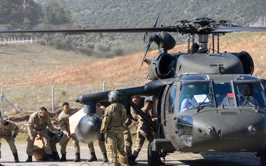 A U.S. Army UH-60M Black Hawk assigned to 1st Armored Division, Combat Aviation Brigade (1AD CAB), delivers relief supplies to the Turkish relief authorities in Hassa, Turkey, Feb. 21, 2023. The 1AD CAB provides dynamic lift capability in direct support of USAID and Turkish relief efforts, to those affected by the earthquakes in Turkey.