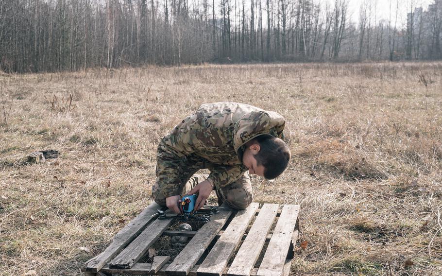 Denys, 23, prepares a drone for testing. He is a former soldier, wounded in the war, who now works on quality control testing for SocialDrone.