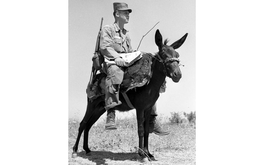 Army Pfc. Howard L. Fields of Fayetteville, N.C., and E Company, 187th Infantry, rides a mule to deliver copies of Stars and Stripes to scattered Army units near Beirut. The paper was printed at Stripes’ plant in Griesheim, Germany, and flown overnight to Lebanon where some 14,000 U.S. troops were involved in operation Blue Bat, an intervention aimed at protecting the beleaguered Lebanese government.