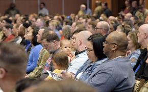 About 500 people listen to a discussion about civilians' access to health care during a town hall meeting at Kadena Air Base, Okinawa, Wednesday, Feb. 1, 2023.