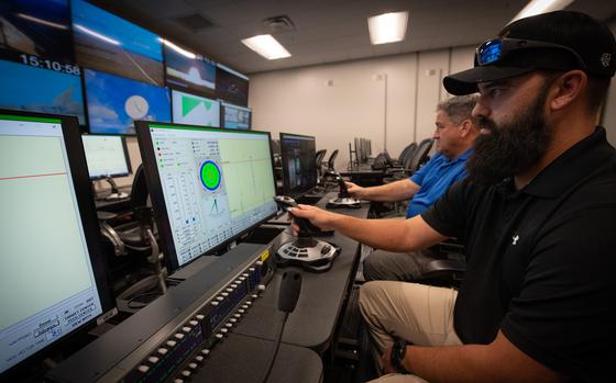Remote control operators with the 96th Test Wing simulate command and control of a high-speed maritime target vessel.