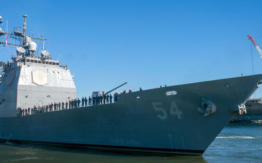 The guided-missile cruiser USS Antietam, which is shifting its homeport to Hawaii, departs Yokosuka Naval Base, Japan, Jan. 26, 2024. 