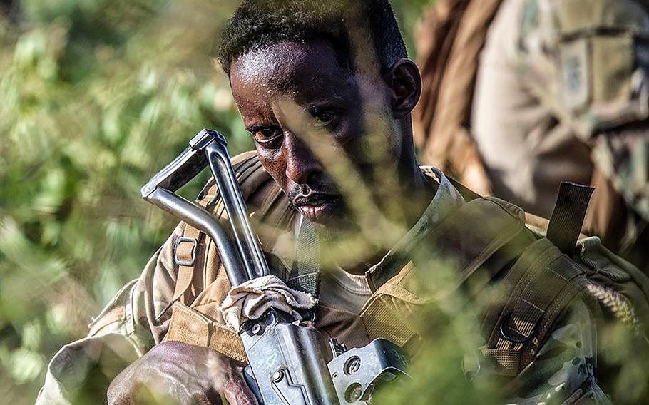 36p na           

A Somali Soldier assigned to the 3rd Danab maintains a watchful eye during a short security halt a on patrol near the town of Wanla Weyn, Somalia, on July 22, 2019. The Danab are a highly trained Somali National Army infantry commando force, named after the Somali word for lightning.

PATRICK W. MULLEN III/U.S. NAVY