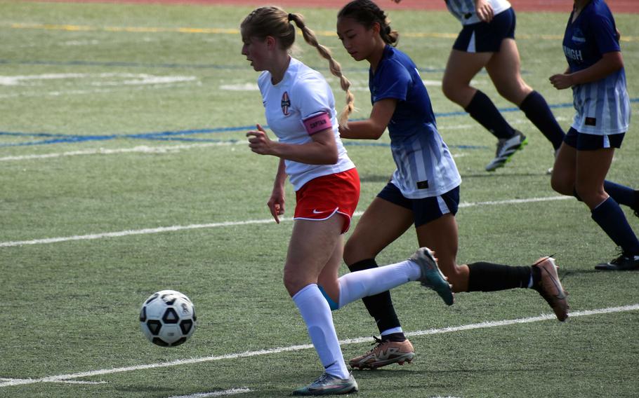 Kinnick’s Bree Withers moves the ball upfield against Guam High during Tuesday’s girls Division I soccer playoffs. The Red Devils won 3-0, but lost later in the semifinals and are still in the hunt for third place.
