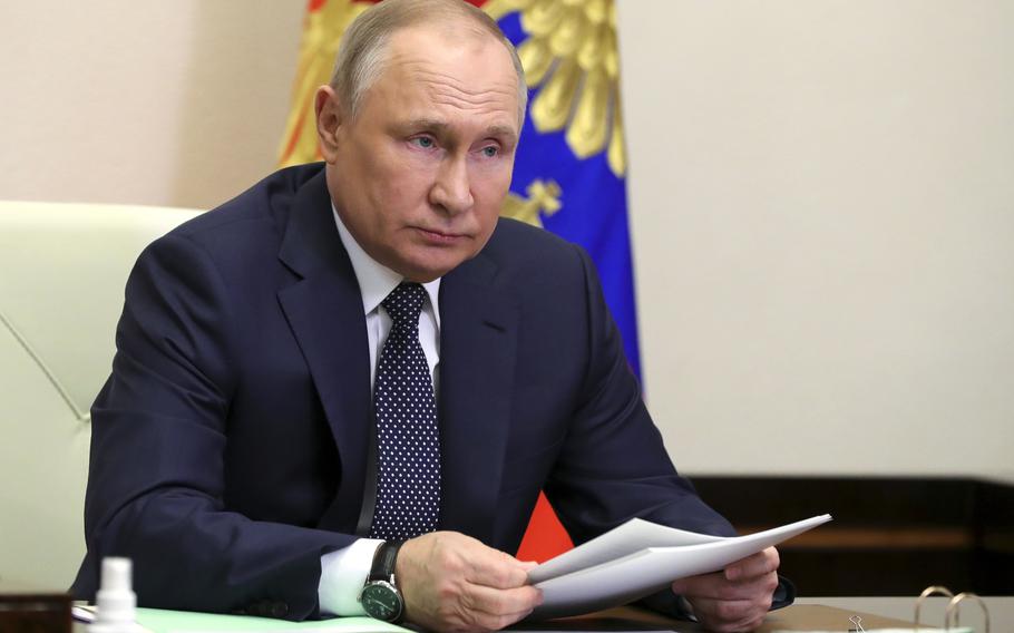 Russian President Vladimir Putin attends a meeting with top officials on support to aviation industry in Russia amid western sanctions vis videoconference at the Novo-Ogaryovo residence outside Moscow, Russia, Thursday, March 31, 2022.