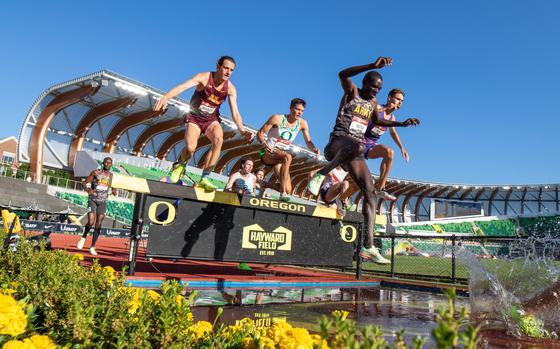 Sgt. Anthony Rotich completes the water jump during the Men's 3,000m steeplechase preliminary round at the 2023 USA Track and Field Outdoor Championships held in Eugene, Oregon, July 6, 2023. Rotich qualified for the steeplechase final, which was held later in the competition. (U.S. Army Photo by Staff Sgt. Michael Hunnisett)
