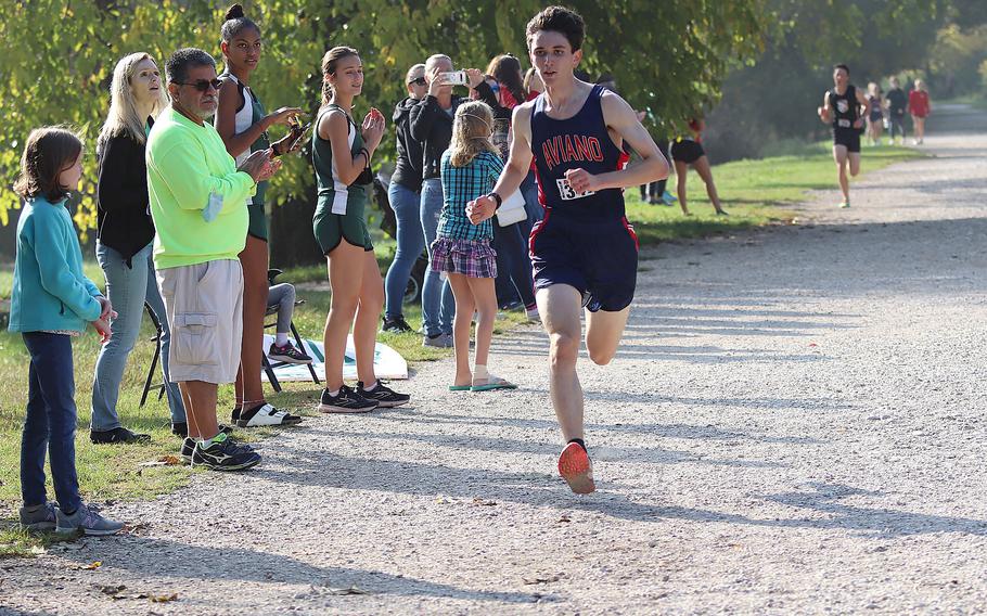 Aviano's Matthew Flemming, who finished in first place in the boys race with a time of 17:23, sprints to the finish line of the DODEA South cross country championships Saturday, Oct. 23, 2021, at Lago di Fimon, Italy.