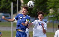 Nathan Pierce of Brussels heads the ball away from Sigonella’s Gabriell Naselli, in the boys Division III final at the DODEA-Europe soccer championships in Kaiserslautern, Germany, May 19, 2022. 
