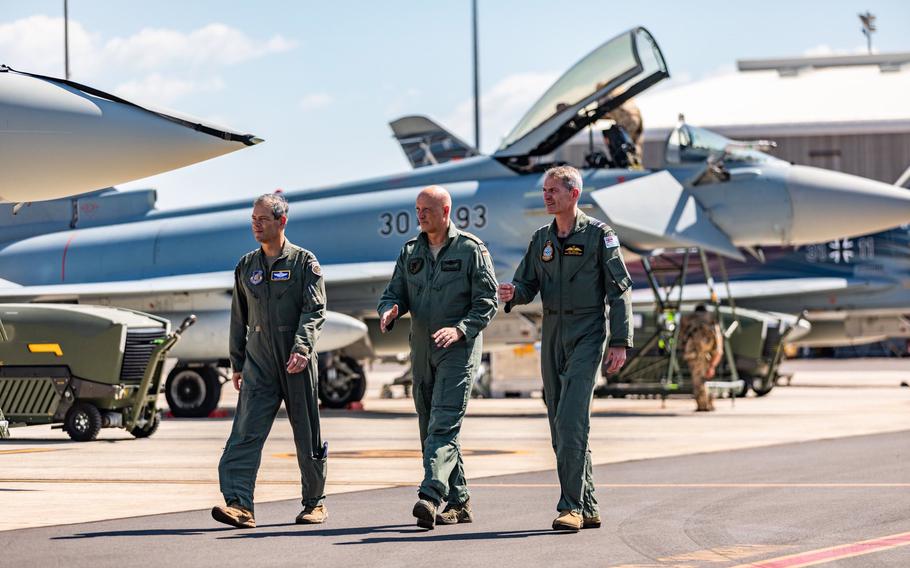 German air force chief Lt. Gen. Ingo Gerhartz, center, walks with U.S. Air Force Gen. Ken Wilsbach, the Pacific Air Forces commander, left, and Australian Air Marshal Rob Chipman on Sept. 5, 2022, in Australia’s Northern Territory.