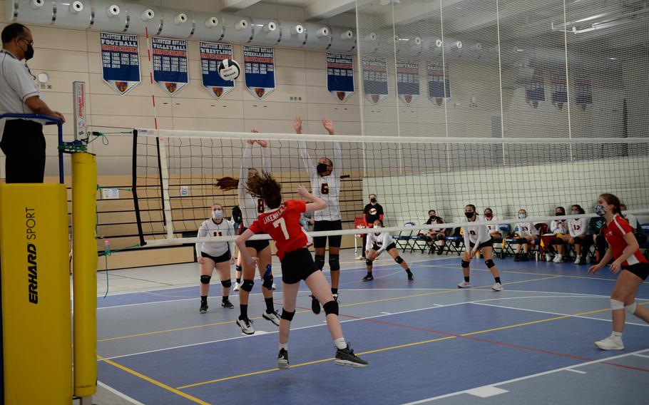 Members of the Vilseck Vilseck Falcons go to the net with the Lakenheath Lancers during the DODEA-Europe Division I Volleyball Tournament at Ramstein Air Base, Germany, Oct. 29, 2021. 