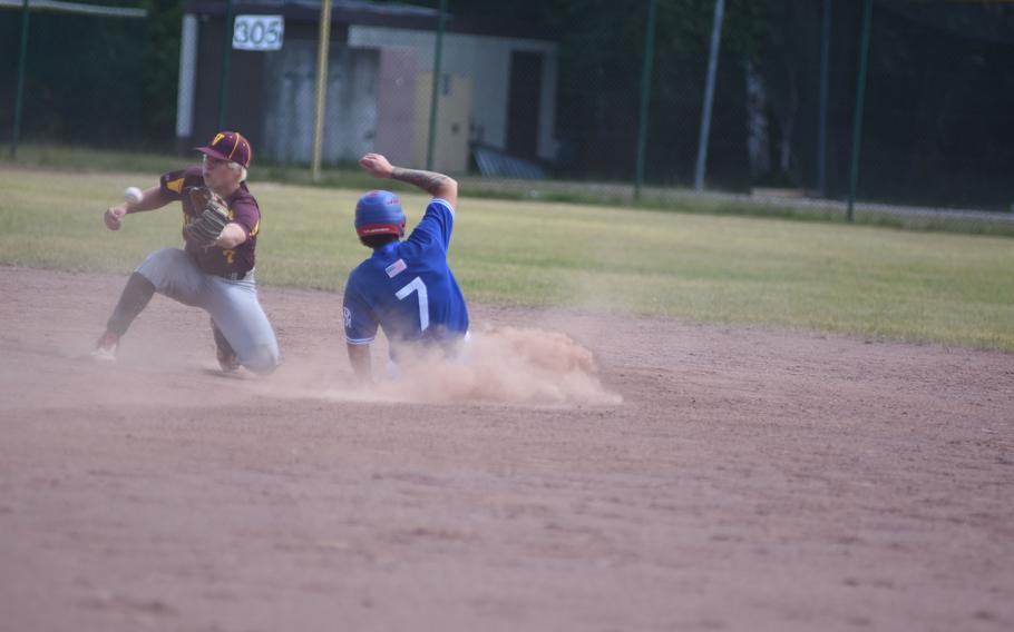 Ramstein's William Schmiedel slides into second as Vilseck's Jacob Boyle tries to handle the throw from home Thursday, May 22, 2025, in a semifinal game at the DODEA-Europe Division I baseball championships at Ramstein Air Base, Germany.