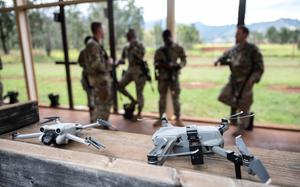 Two small unmanned aircraft systems, also known as "drones," are set up for use during Exercise NEXUS FORGE, Feb. 5, 2025, at Schofield Barracks, Hawaii. As small UAS threats evolve, so must the systems and training used to counter them, with continued investment in AI-driven detection, directed radio frequency weapons and next-generation electronic warfare solutions. (U.S. Air Force photo by Master Sgt. Jeffrey Grossi)