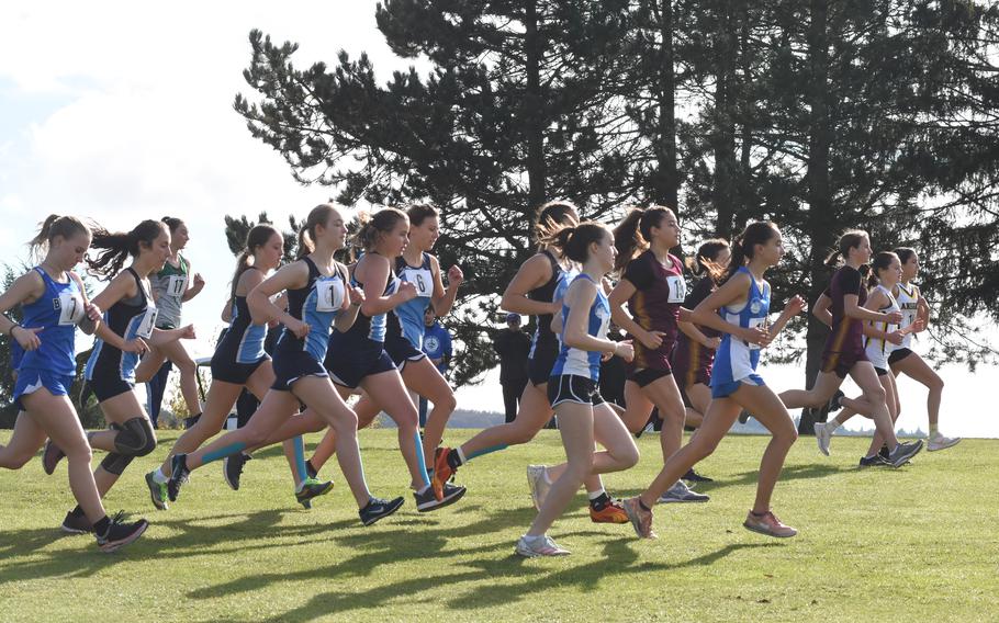Runners take off near the start of the girls’ small schools division race at the DODEA-Europe cross country championships on Saturday, Oct. 23, 2021. The meet was held at the Baumholder Rolling Hills Golf Course in Germany for teams north of the Alps.