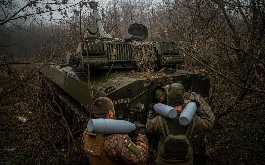 Ukrainian artillerymen from the 24th brigade load an ammunition inside of a 2S1 Gvozdika self-propelled howitzer at a position along the front line in the vicinity of Bakhmut, Donetsk region, on Dec. 10, 2022, amid the Russian invasion of Ukraine.