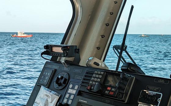 Crews from the U.S. Navy and Coast Guard continue their search for a missing scuba diver off Guam's coast, Saturday, Feb. 4, 2023. 
