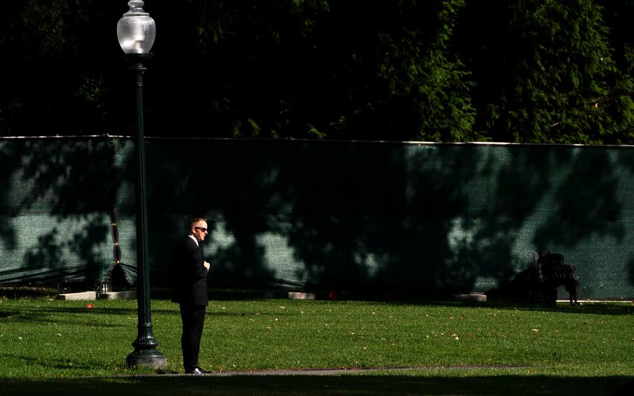 A Secret Service Agent watching during US President Joe Biden departure on the South Lawn at the White House in Washington on September 20, 2021. MUST CREDIT: Washington Post photo by Demetrius Freeman