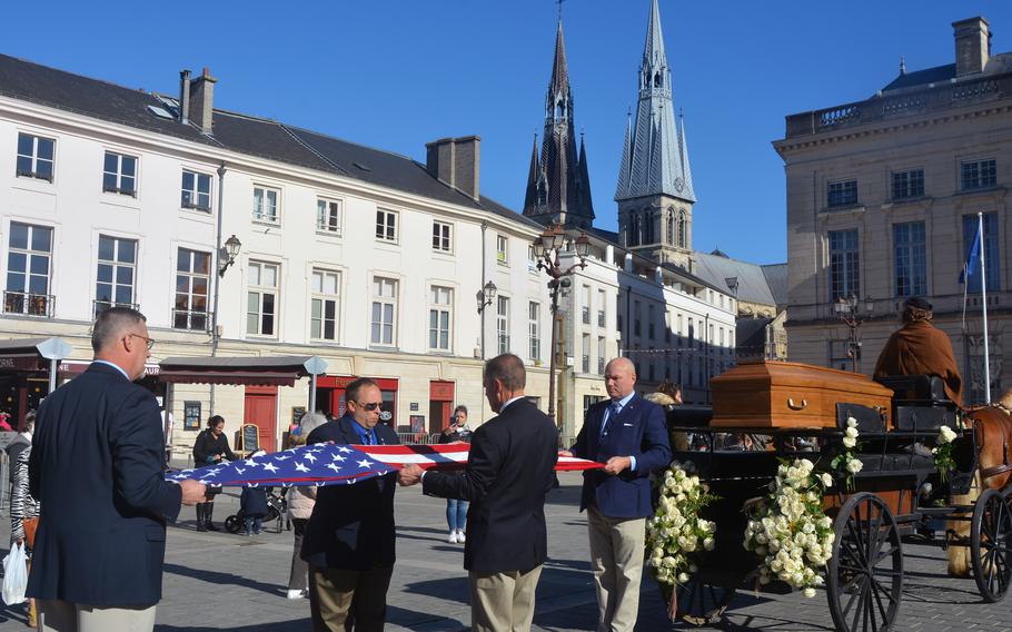Society of the Honor Guard, Tomb of the Unknown Soldier members Lonny LeGrand, Dave Hathaway, George March and James Livingston fold the American flag on Oct. 24, 2021, following the end of ceremonies remembering the selection of the U.S. Unknown Soldier 100 years ago in Chalons-en-Champagne, France. 