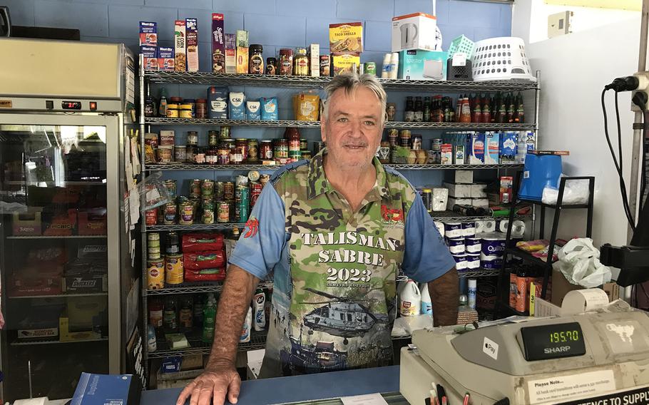 Bevon Haynes poses behind the register at the Plum Tree Store in Stanage Bay, Australia, Wednesday, Aug. 2, 2023. The Talisman Sabre exercsie is a big deal with the isolated beach community, he said.