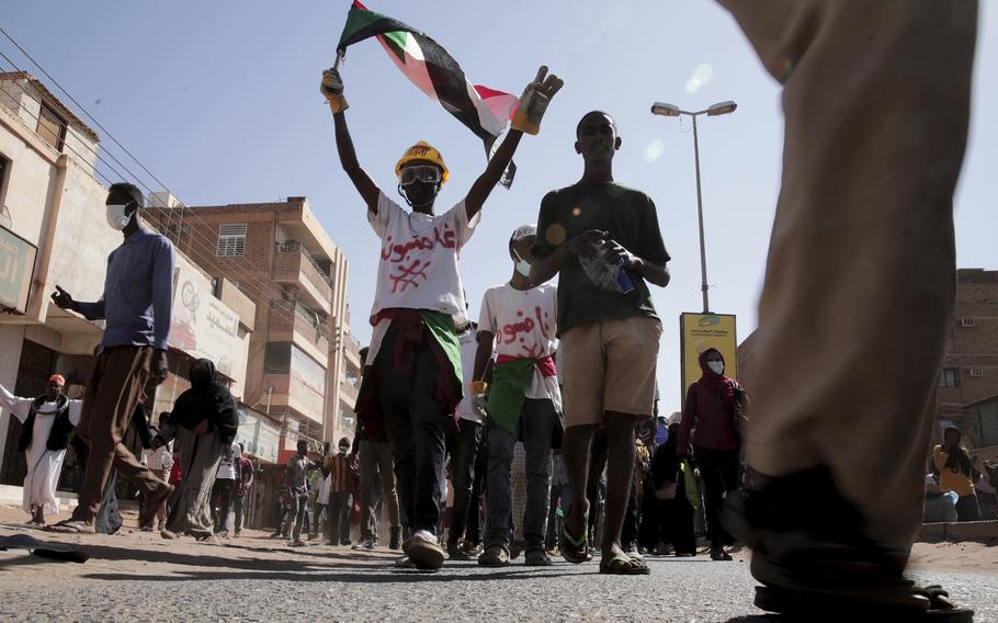 People chant slogans during a protest to denounce the October 2021 military coup, in Khartoum, Sudan, Thursday, Jan. 6, 2022. Sudanese took to the streets in the capital, Khartoum, and other cities on Thursday in anti-coup protests as the country plunged further into turmoil following the resignation of the prime minister earlier this week. 