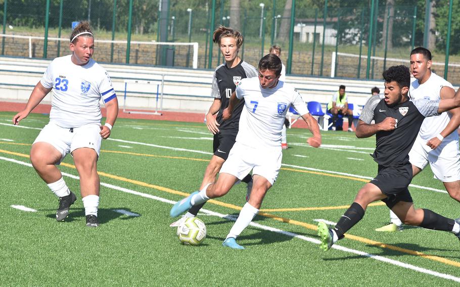 Wiesbaden's Alessandro Eiseman is surrounded by friends and foes Wednesday, May 18, 2022, at the DODEA-Europe boys Division I soccer semifinals at Ramstein Air Base, Germany.