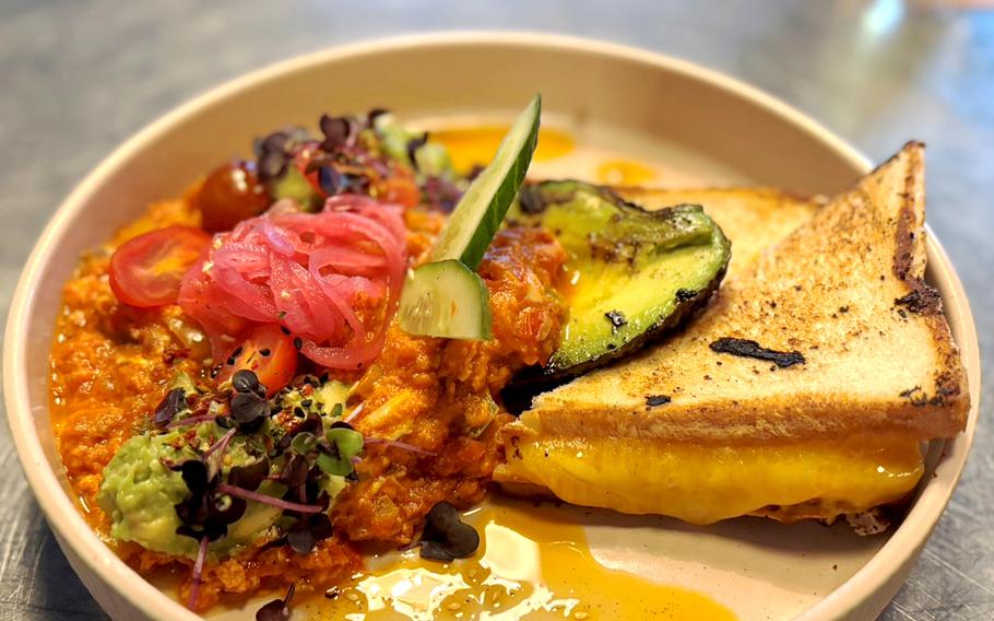 A grilled cheese with grilled vegetables.