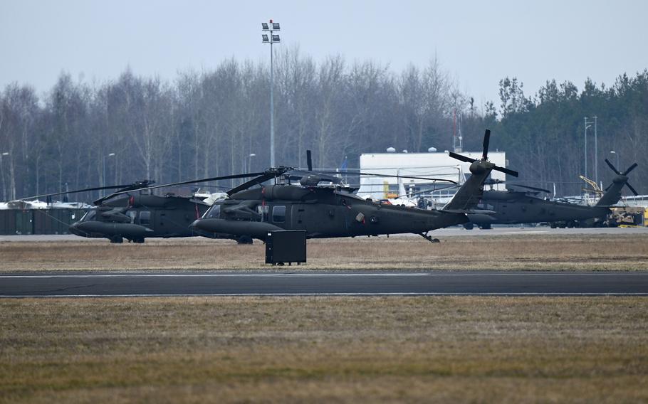 U.S. Army UH-60 Black Hawk helicopters sit on an airfield on the outskirts of Mielec, Poland, Feb. 26, 2022.