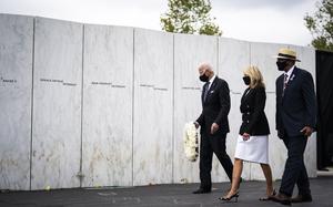 Joe Biden, then the Democratic presidential nominee, with wife Jill Biden, lays a wreath at the wall of names at the Flight 93 National Memorial on Sept. 11, 2020, in Shanksville, Pa. MUST CREDIT: Washington Post photo by Jabin Botsford