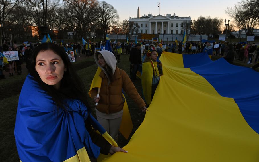 Iryna Tomaieva, left, gathers with others to show their support for Ukraine near the White House on Feb. 27, 2022.