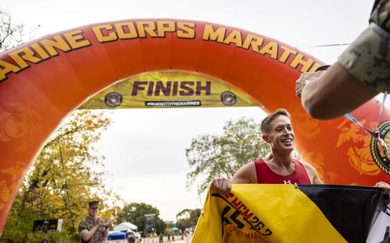 Kyle King finishes in first place of the 2024 Marine Corps Marathon with a time of 2:25:06, the fastest time out of 16,556 other racers, Sunday, Oct. 27, 2024 in Arlington, VA. (Eric Kayne/Stars and Stripes)