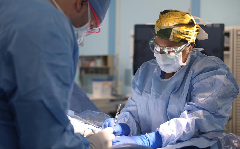 Navy Capt. Kristina Morocco begins a surgery aboard the hospital ship USNS Mercy off the coast of Koror, Palau, Dec. 27, 2023.