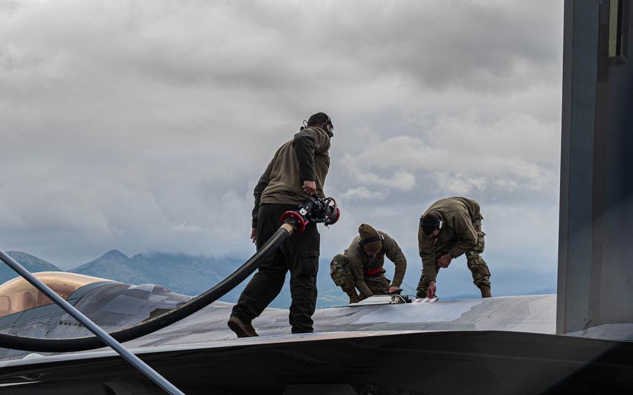 Airmen from Langley Air Force Base’s 94th Fighter Squadron and 192nd Wing work on an F-22 during an exercise in Alaska.