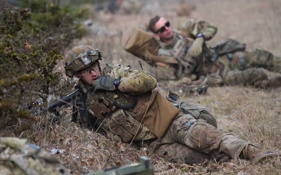 Sgt. Devlin Hendrix, of the 2nd Cavalry Regiment, equipped with a device linked to the Integrated Tactical Network, communicates with soldiers during a simulated ambush, as part of the Dragoon Ready exercise on Jan. 29, 2023, at the Joint Multinational Readiness Center in Hohenfels, Germany. 